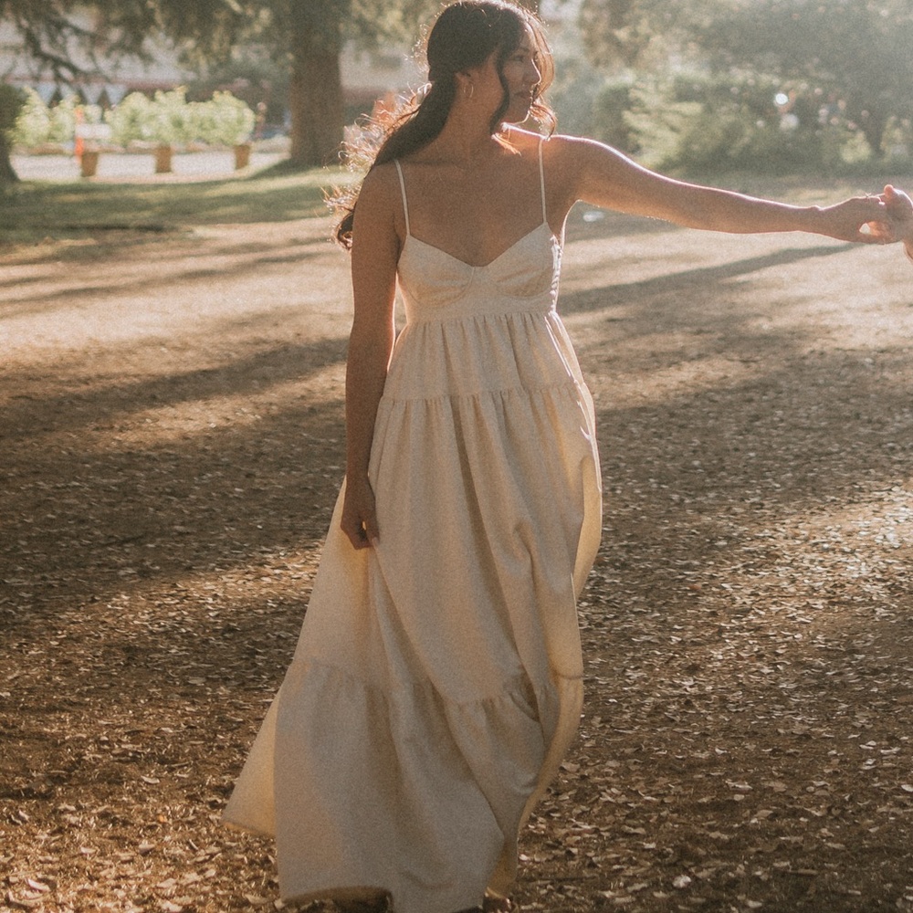 Cream colored tiered dress with back cutout